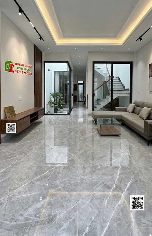 Gạch lát nền 60x120 bóng kính màu xám vân trắng sang trọng