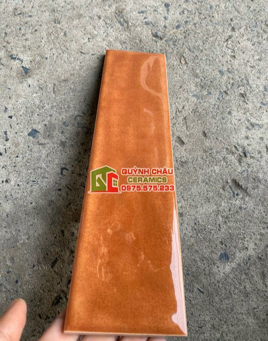 Gạch thẻ 75x300 gợn sóng nâu cam bóng
