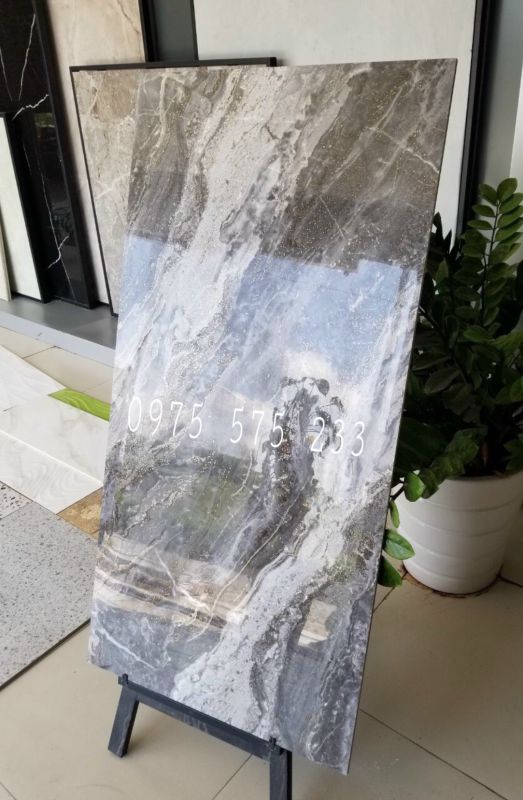 Đá lát nền 60x120 vân đá đồng chất khắc kim nhũ vàng bóng kiếng 20