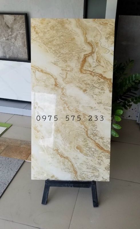 Gạch cao cấp 60x120 vân mây vàng nhũ vàng kim bóng kiếng chất lượng đẹp 24