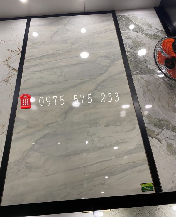 Gạch ốp lát sảnh phòng khách 60x120 màu xám bóng kiếng đẹp