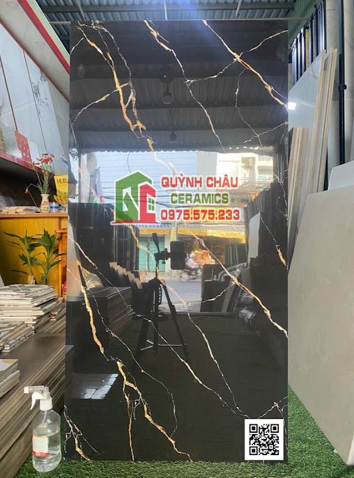 Gạch 60x120 đen điểm vân vàng đá đồng chất siêu bóng sang trọng